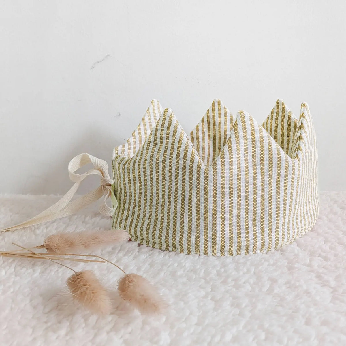 Golden mustard striped linen dress-up crown styled on a soft neutral background