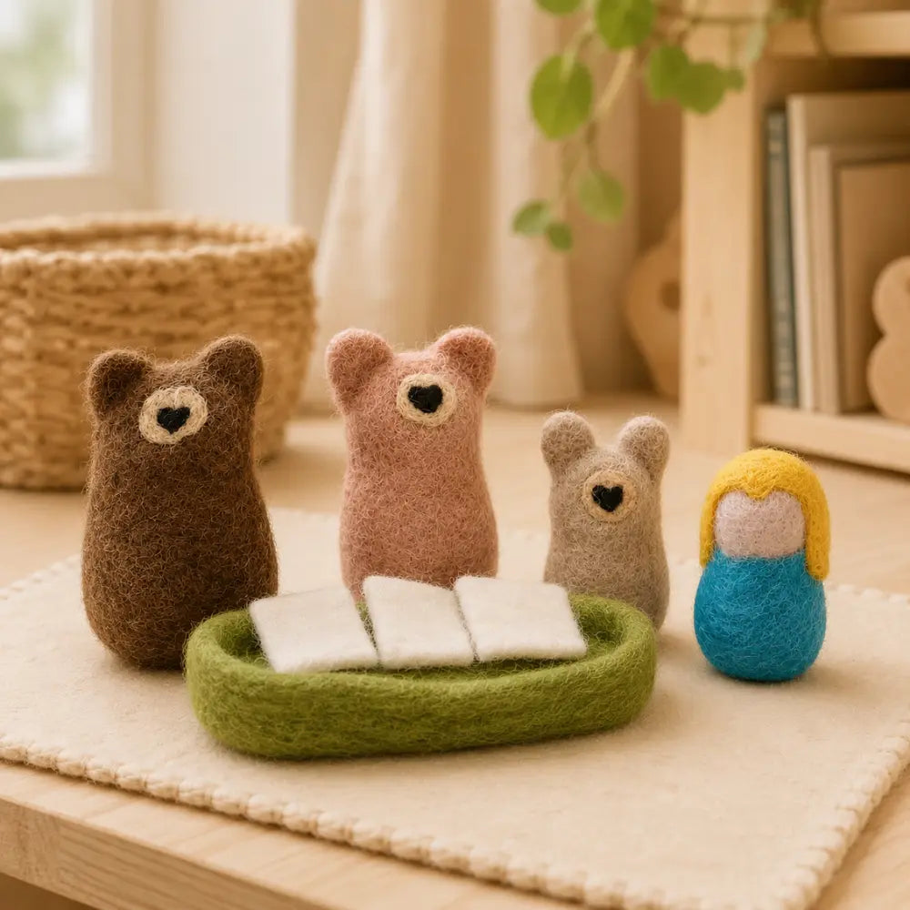 Goldilocks and the Three Bears felt play set arranged in a cozy playroom setting with natural light.