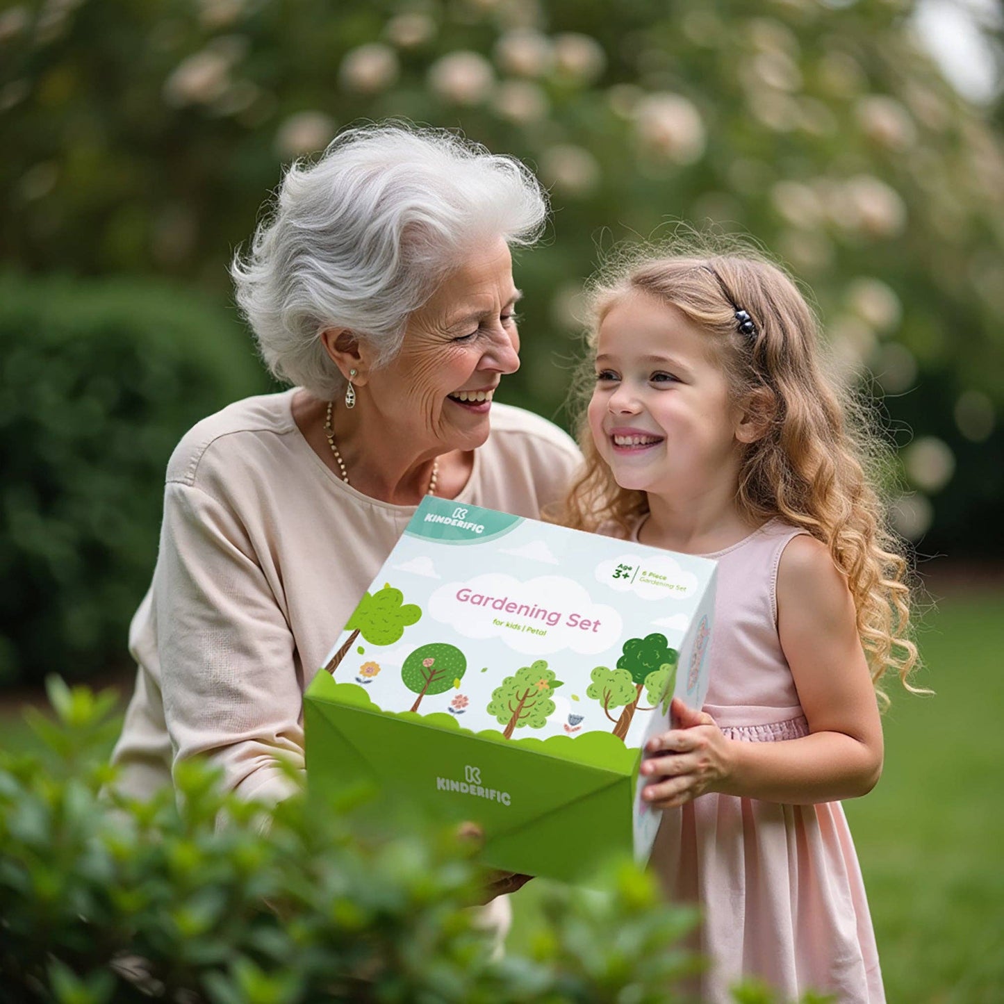 grandmother giving gardening set gift to child outdoors