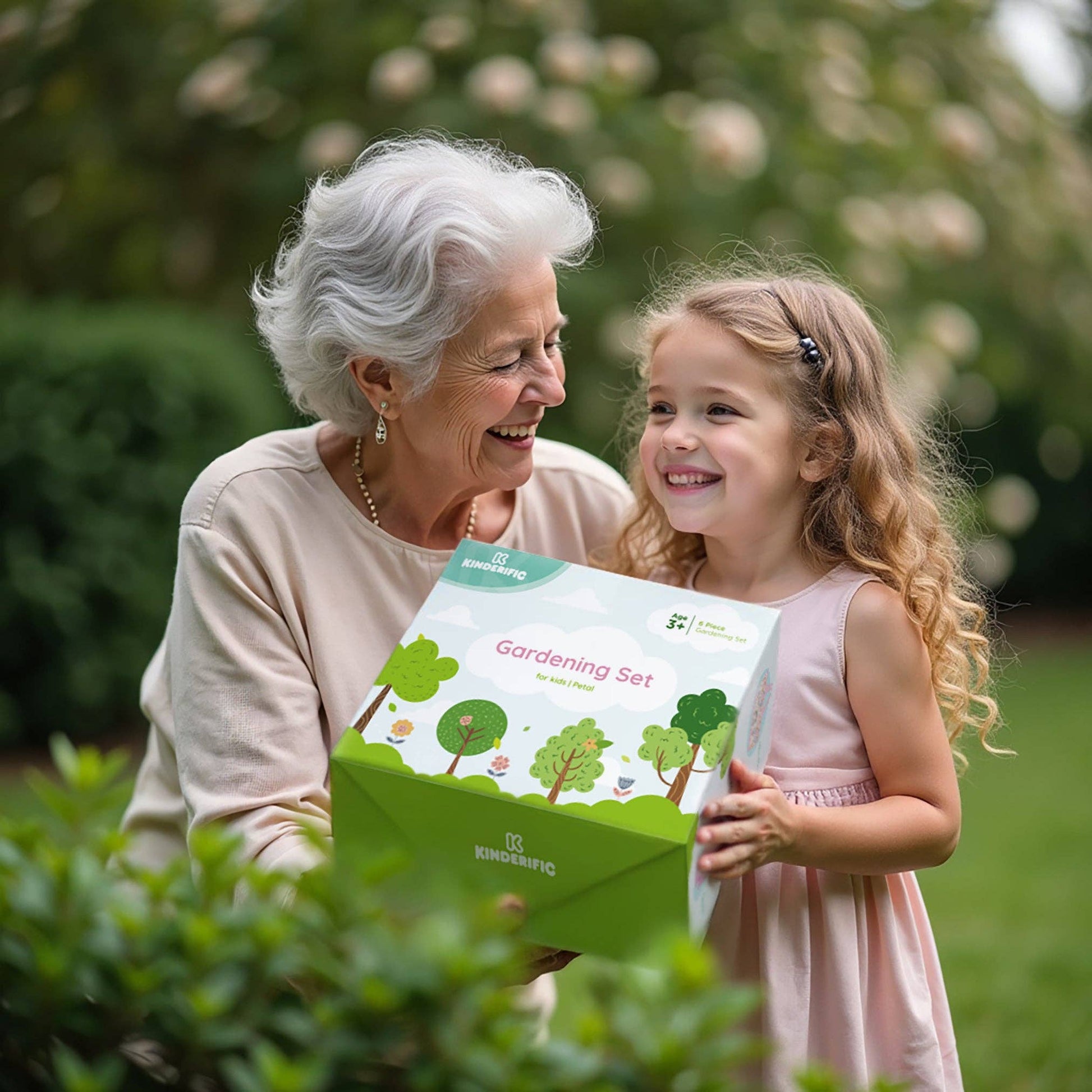 grandmother giving gardening set gift to child outdoors