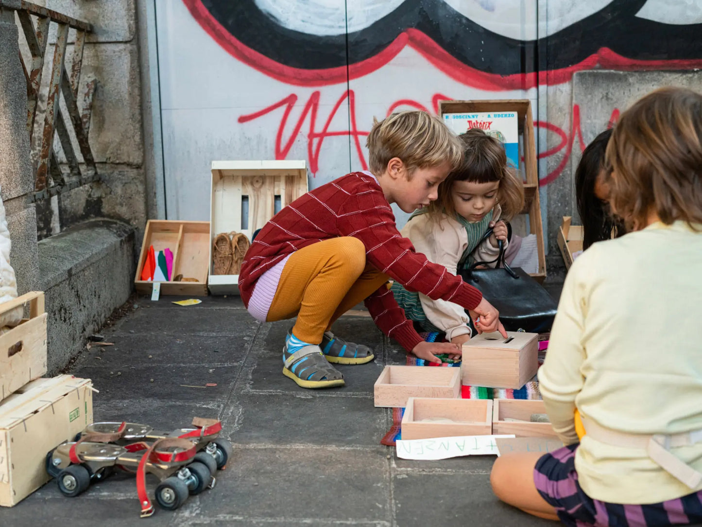 Children playing with toys in an urban setting
