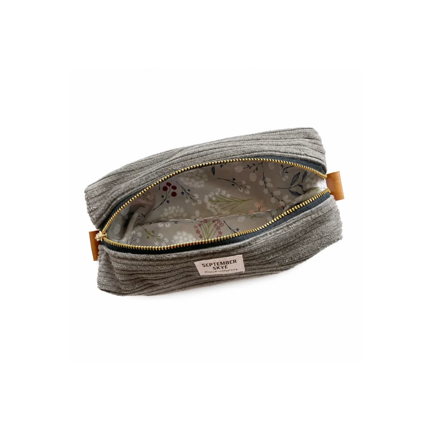 Open gray corduroy pencil pouch showing botanical-print lining and roomy interior