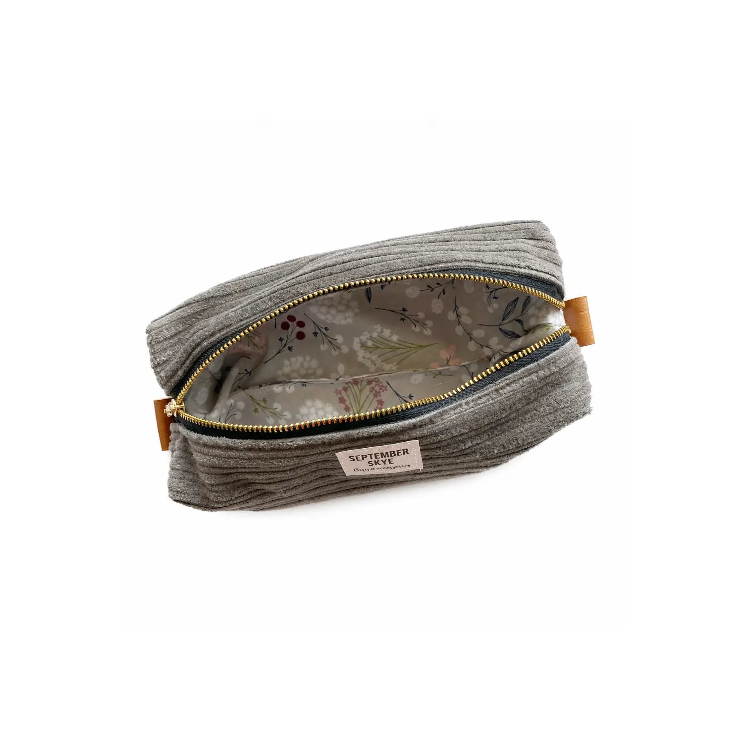 Open gray corduroy pencil pouch showing botanical-print lining and roomy interior