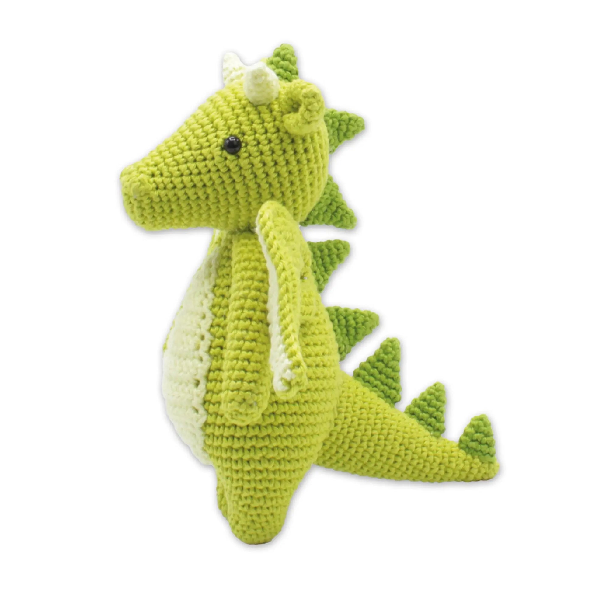 Finished green dragon stuffed animal made from a DIY crochet kit