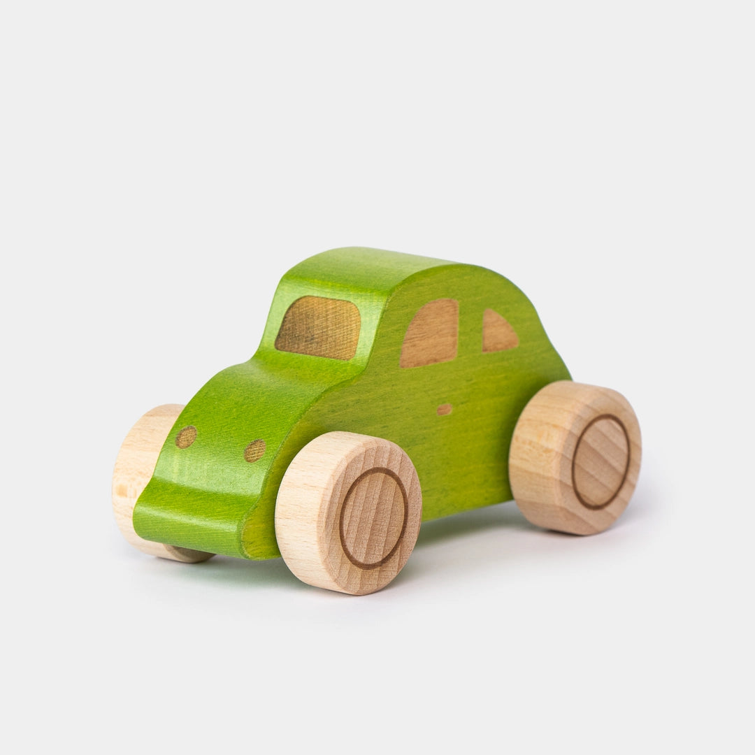 Green wooden beetle toy car front angle view for preschool play 