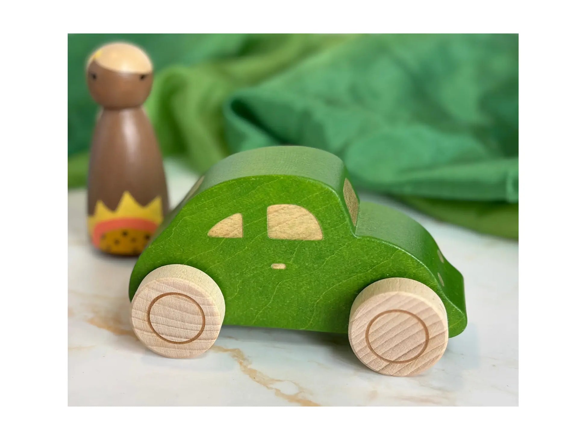 Green wooden beetle toy car made from FSC hardwood