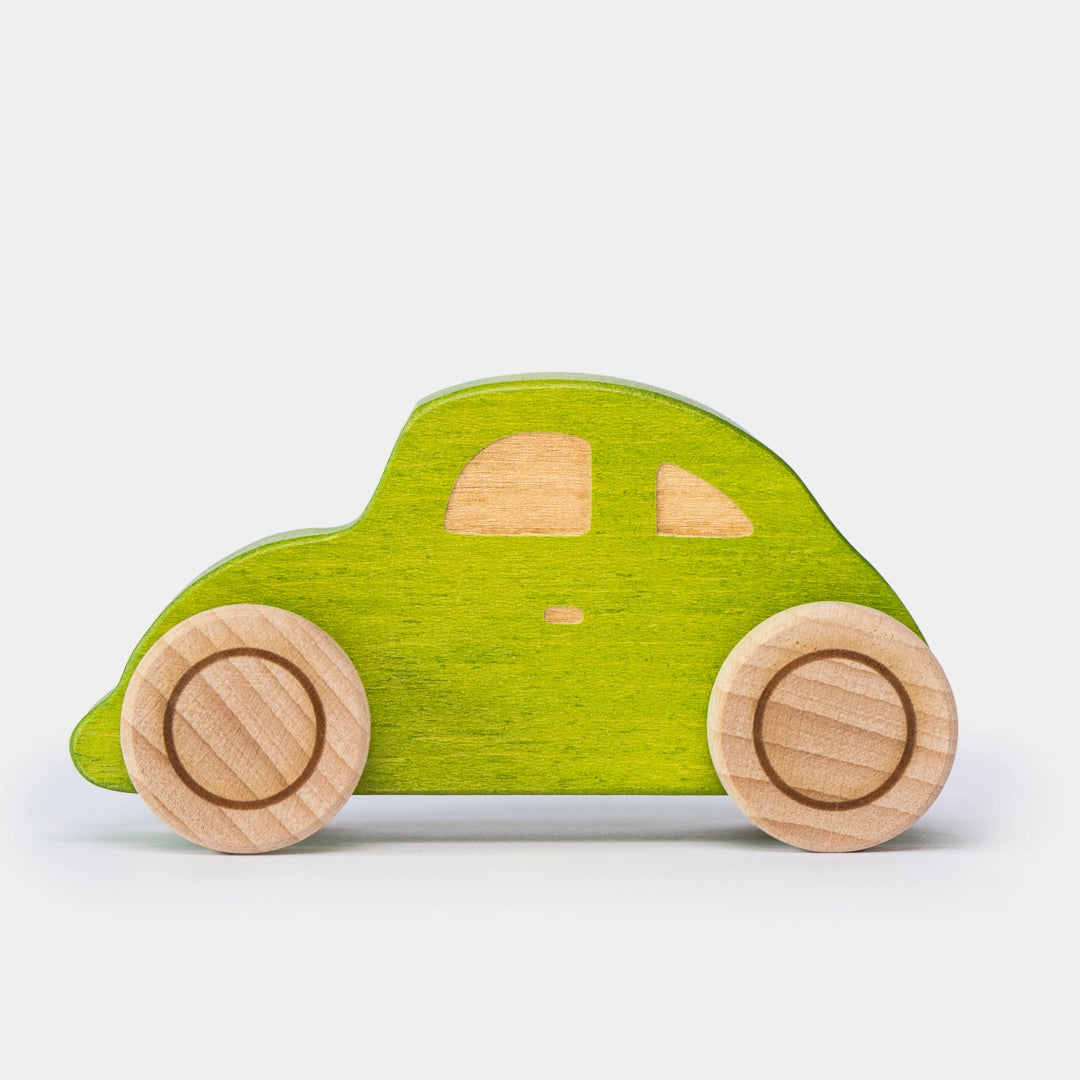 Green wooden beetle toy car side view for preschool play 