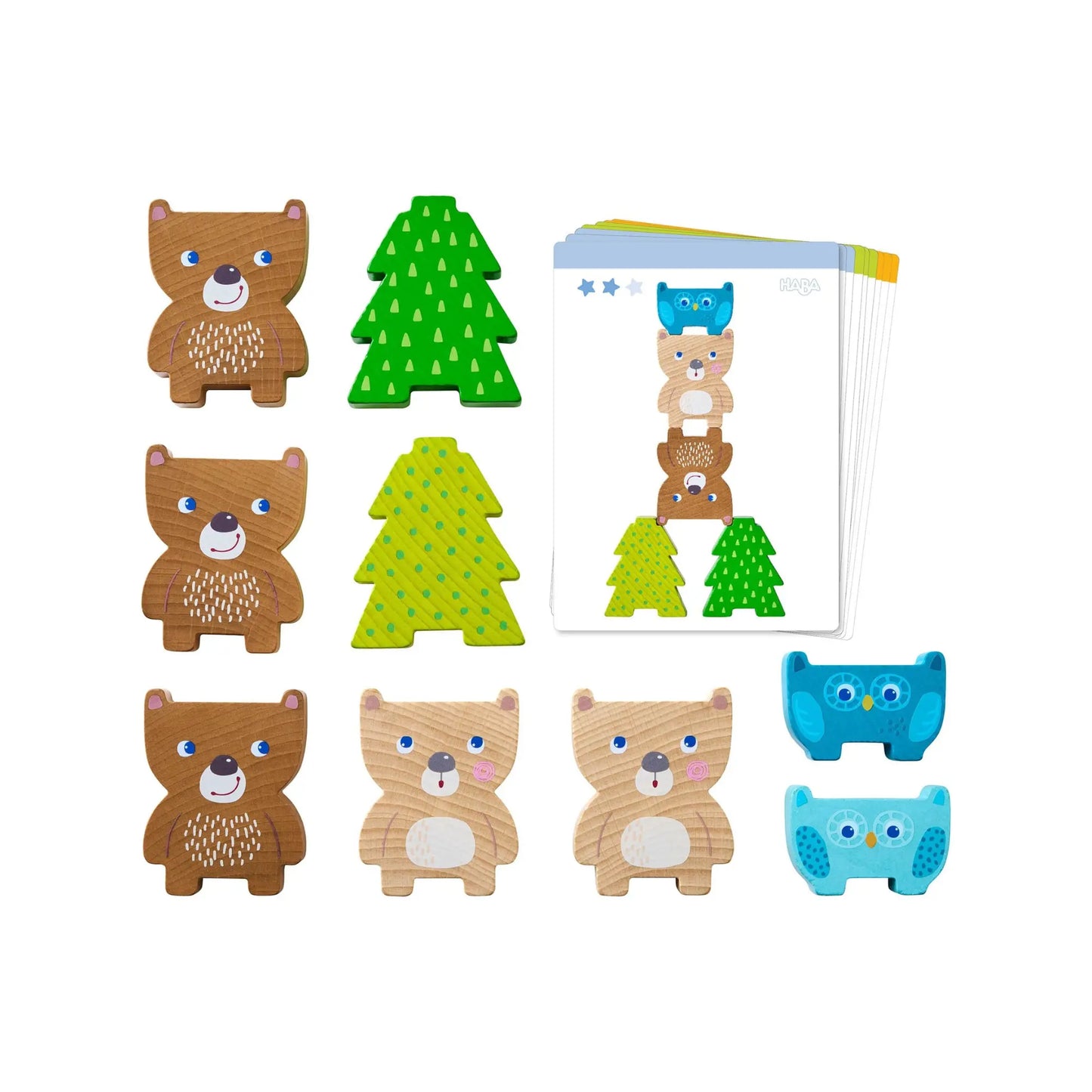 Set of wooden animal toys including bears, trees, and owls on a white background.