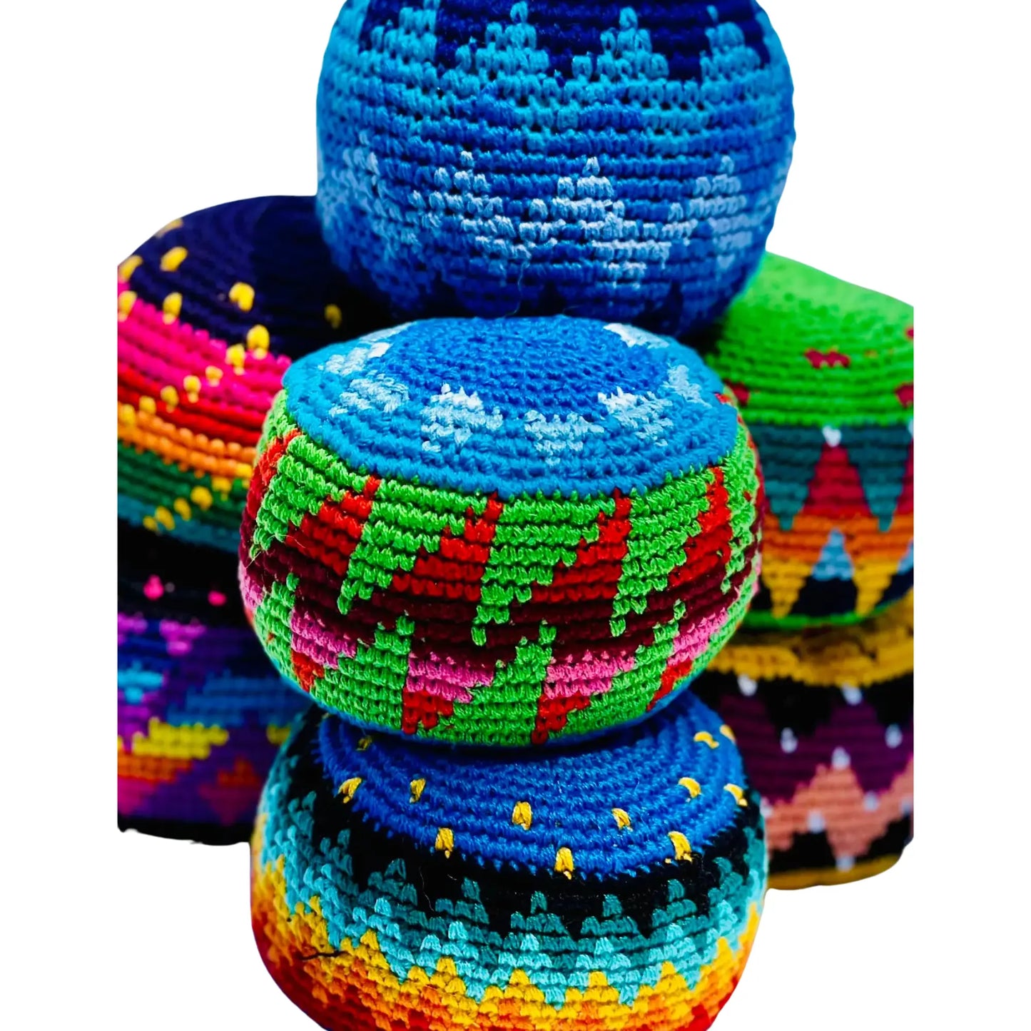 Colorful woven crocheted extra large hacky sacks stacked on a white background