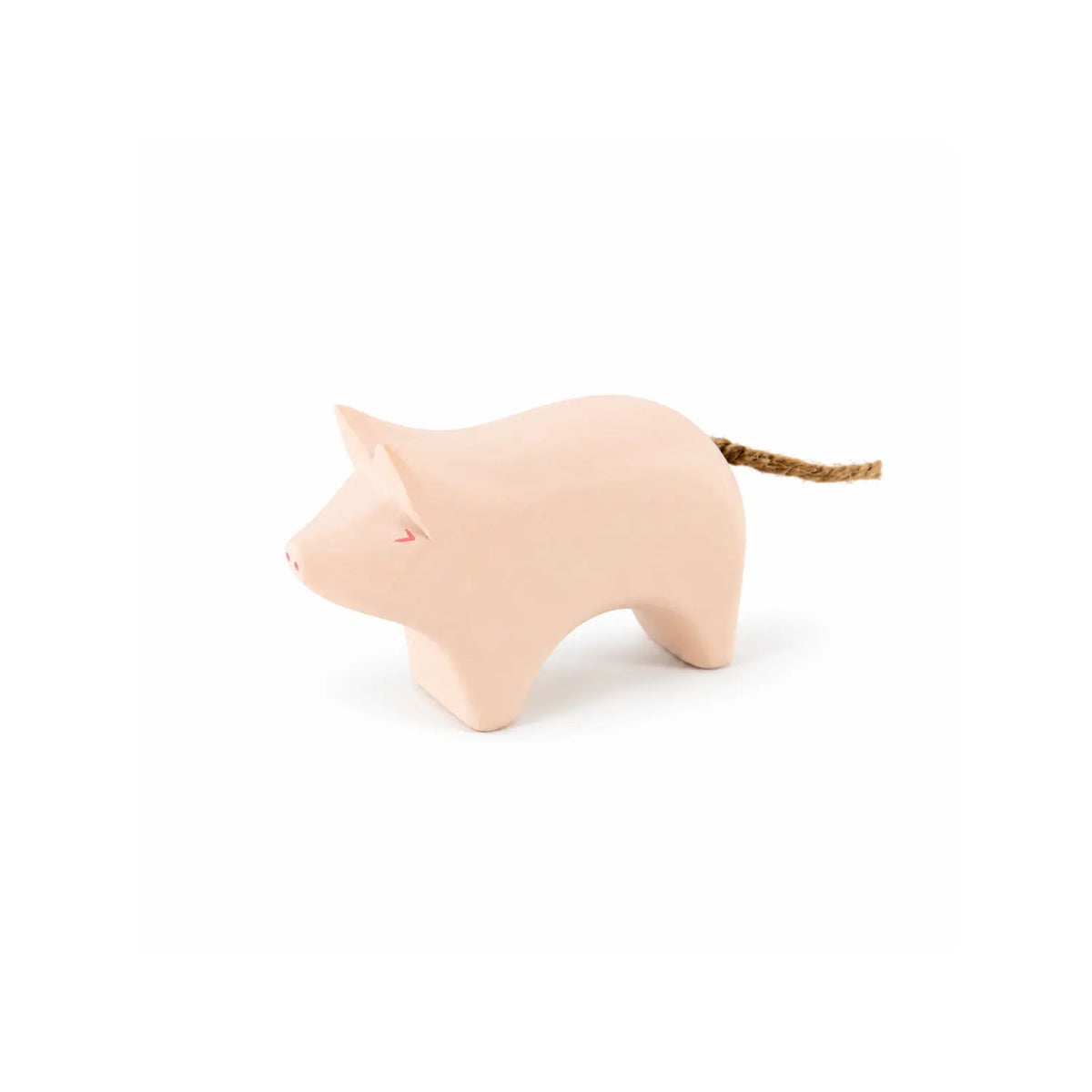 Pink wooden pig toy by Sarah’s Silks with a cord tail, on a white background