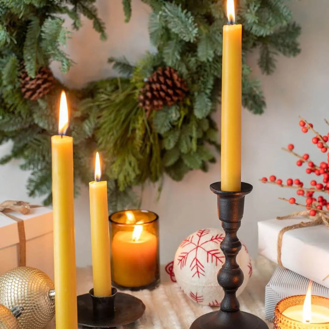 handmade beeswax taper candles in a Christmas scene