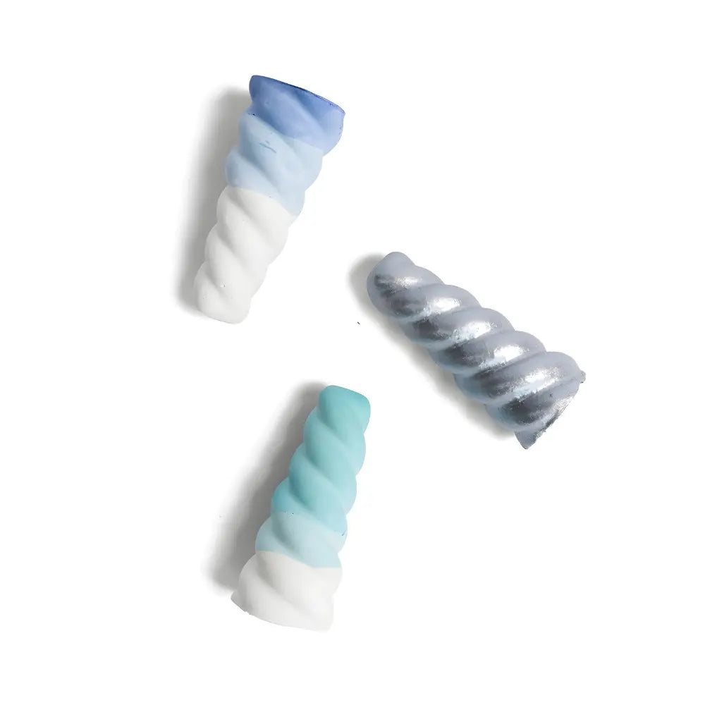 Three swirled pieces of outdoor sidewalk chalk in blue and white on a white background