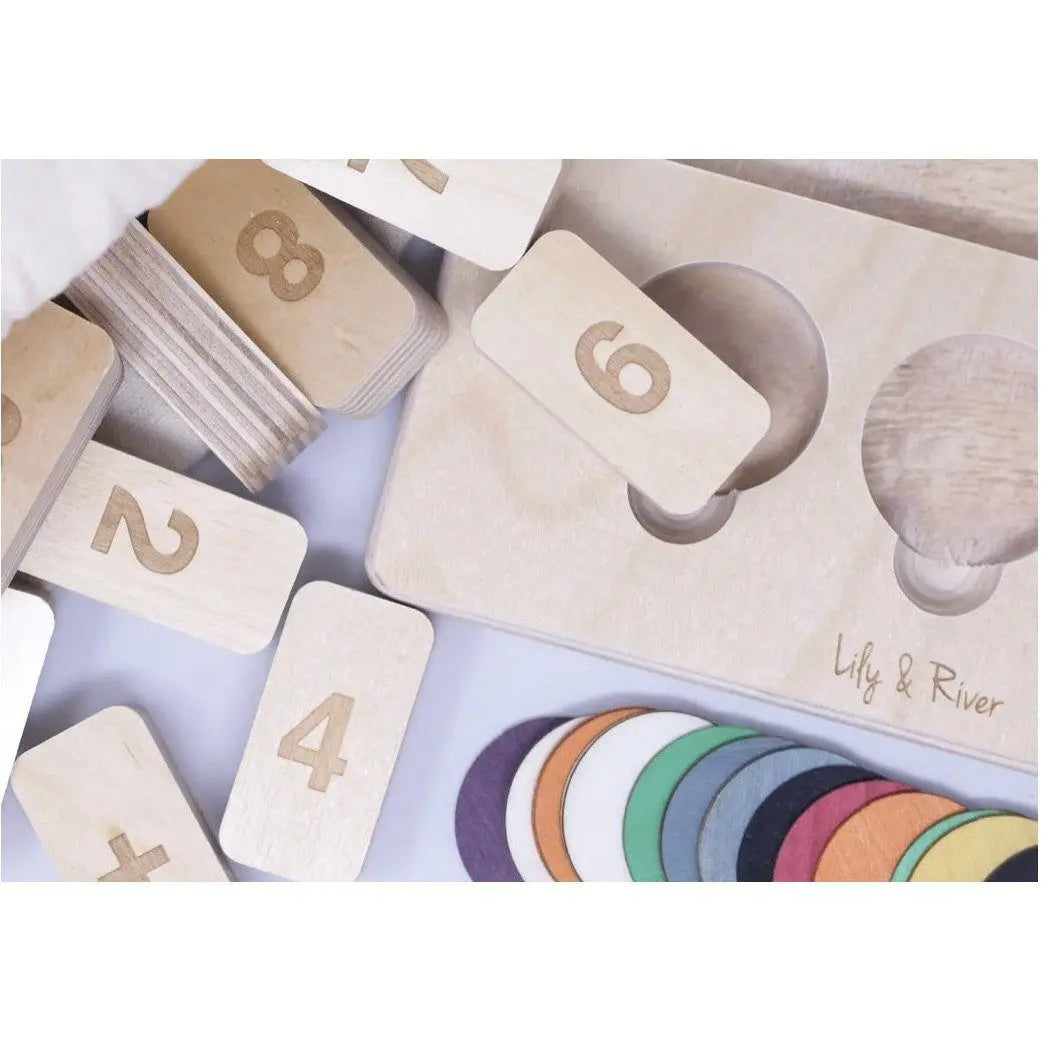 Wooden number blocks with a set of color swatches on a light background