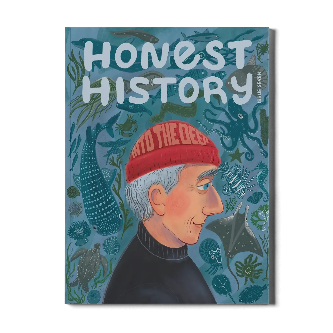Children’s history magazine cover featuring Jacques Cousteau with ocean animals including sharks, rays, turtles, and coral
