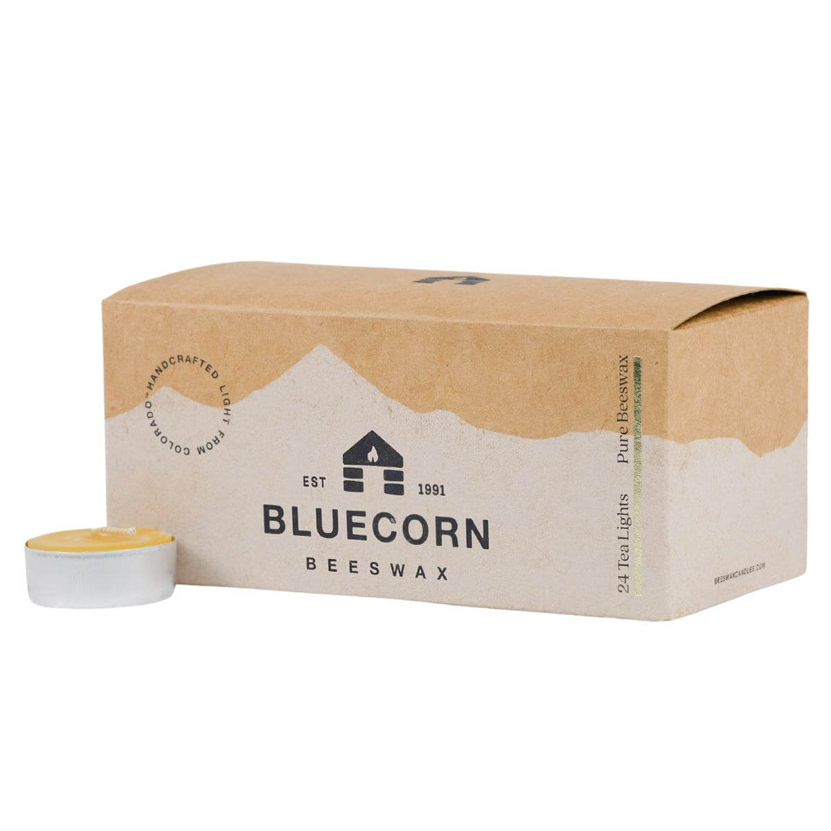 Box of Bluecorn Beeswax tea lights with a single tea light in front on a white background