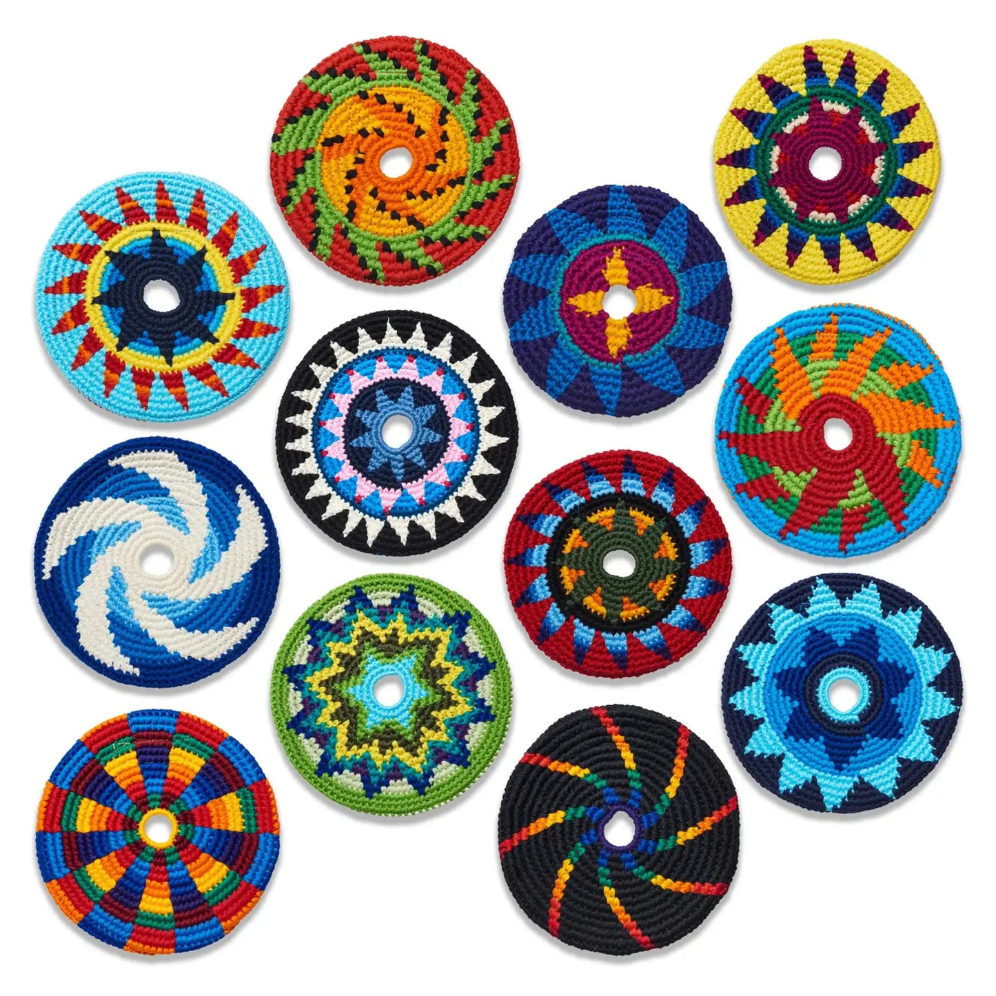 Set of colorful crocheted soft frisbees on a white background