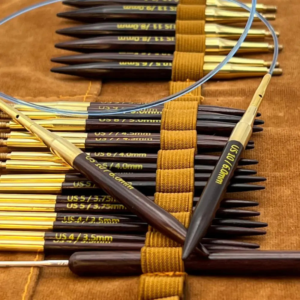 Close-up of polished rosewood circular knitting needle tips