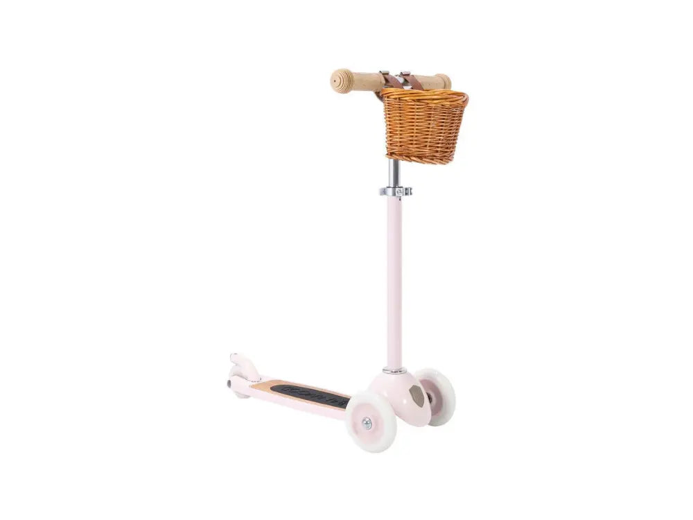 Children's scooter with a wicker basket on a white background