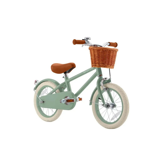 Children's balance bike with a brown seat and basket on a white background
