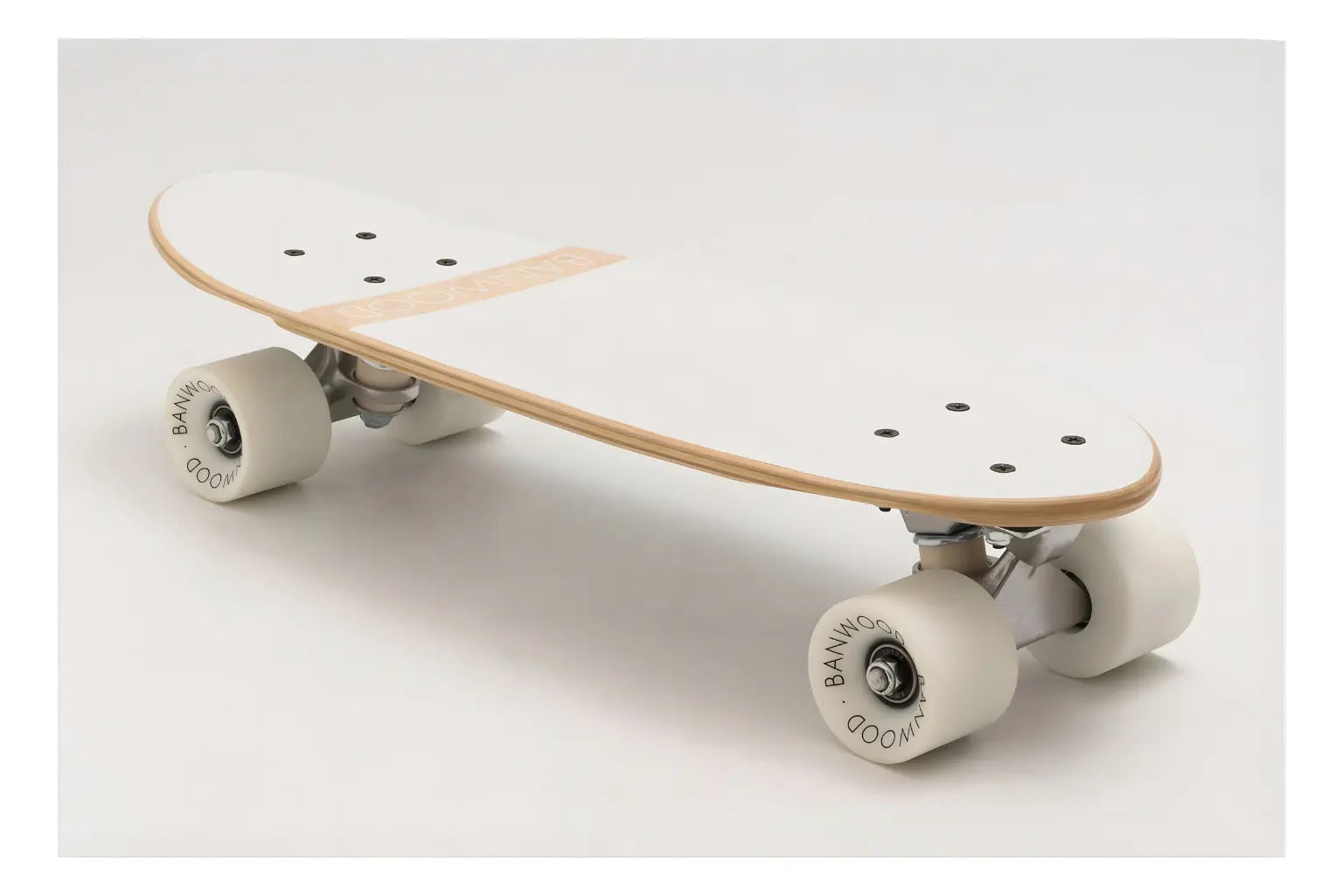 Skateboard with white trucks and wheels on a light gray background