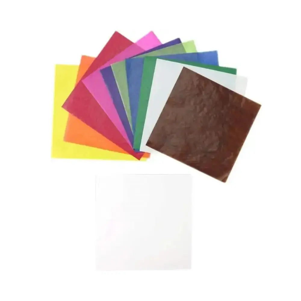 Assorted colorful sheets of kite paper on a white background