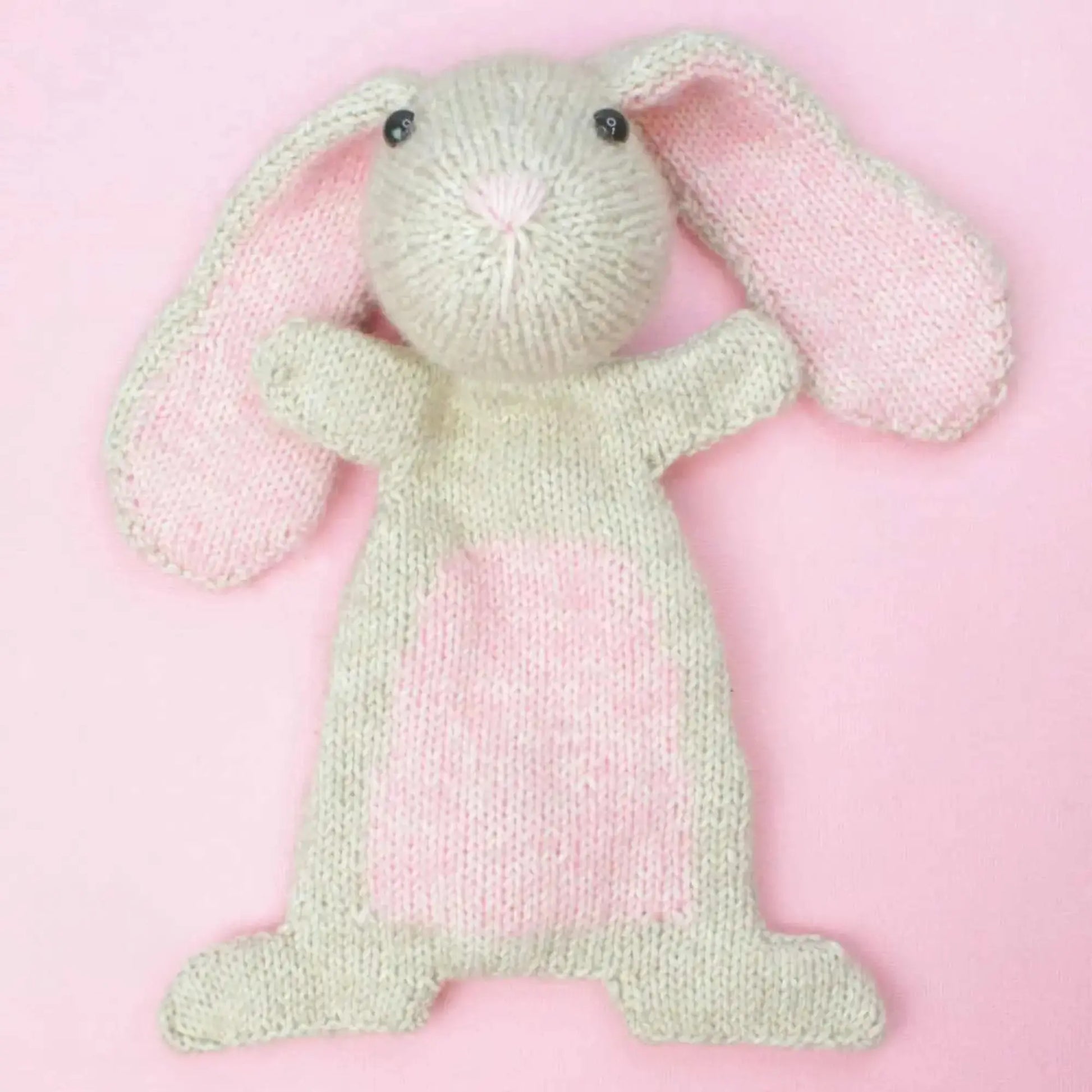 Handmade knitted bunny soft toy with pink belly and long ears