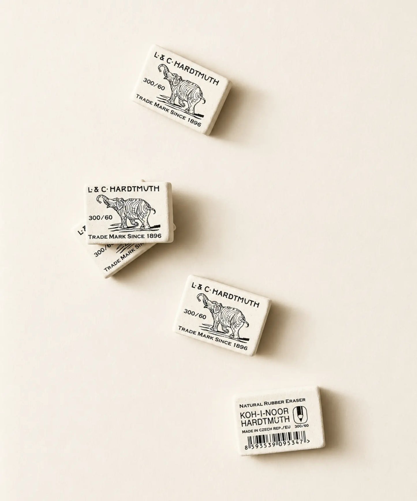 Several natural rubber Koh-I-Noor L&C Hardtmuth rubber erasers showing front and back