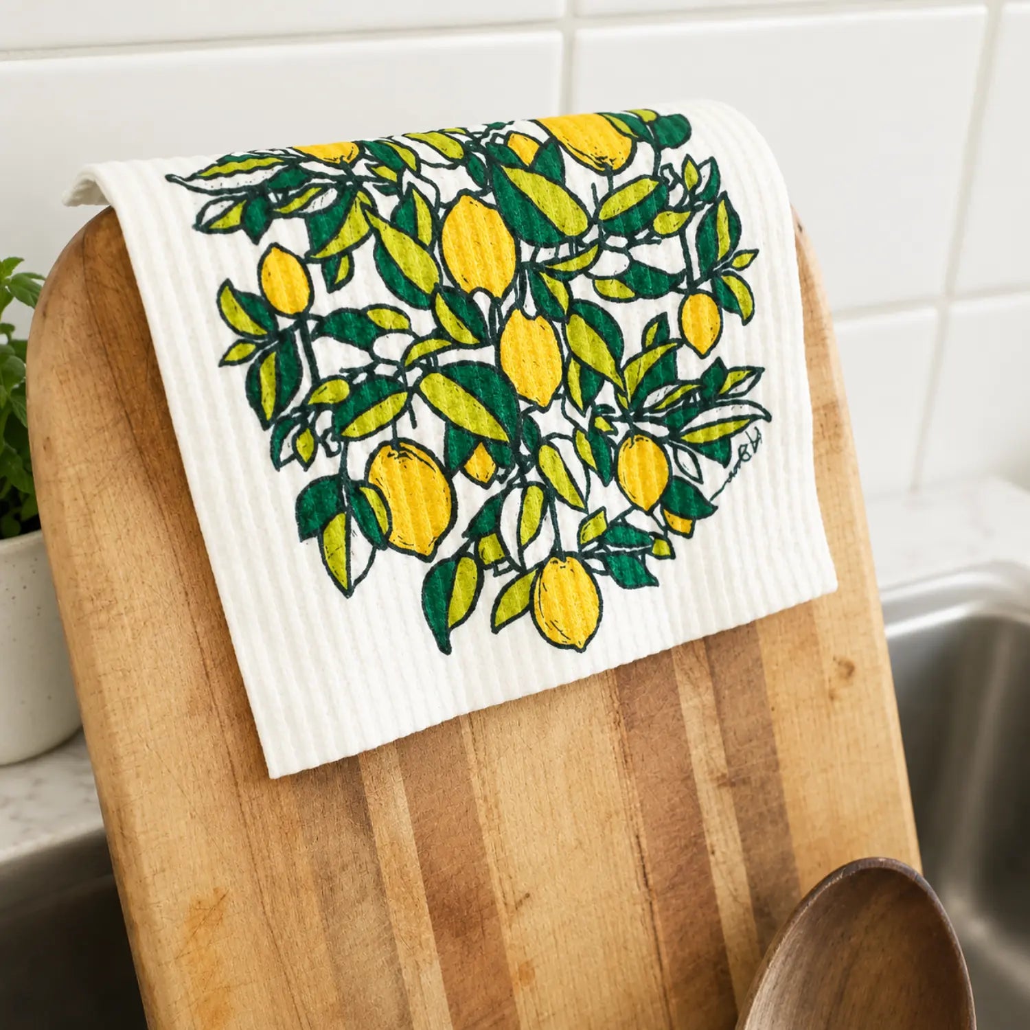 Reusable Swedish dishcloth with yellow lemons and green leafy branches