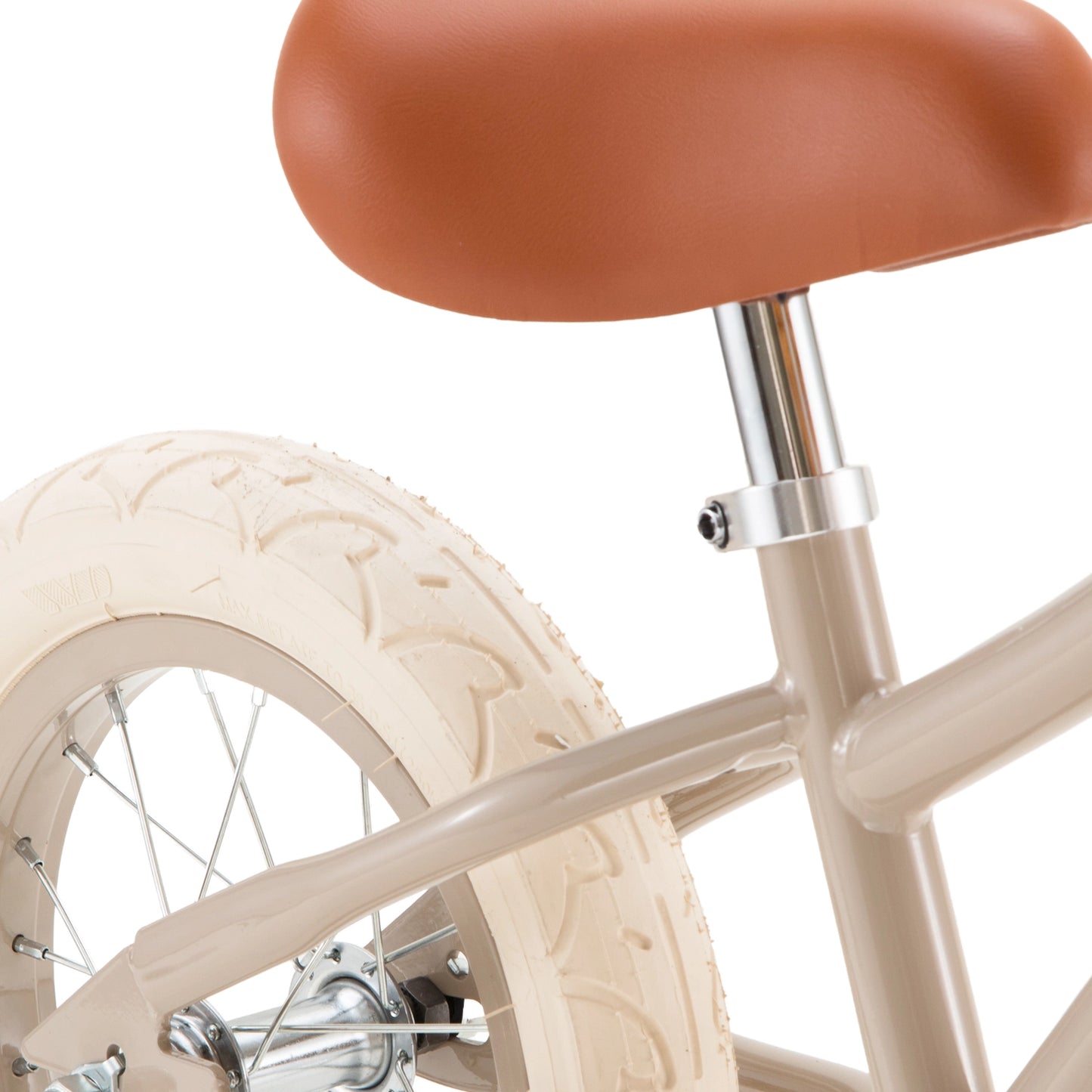 Close-up of a bicycle seat and wheel on a white background