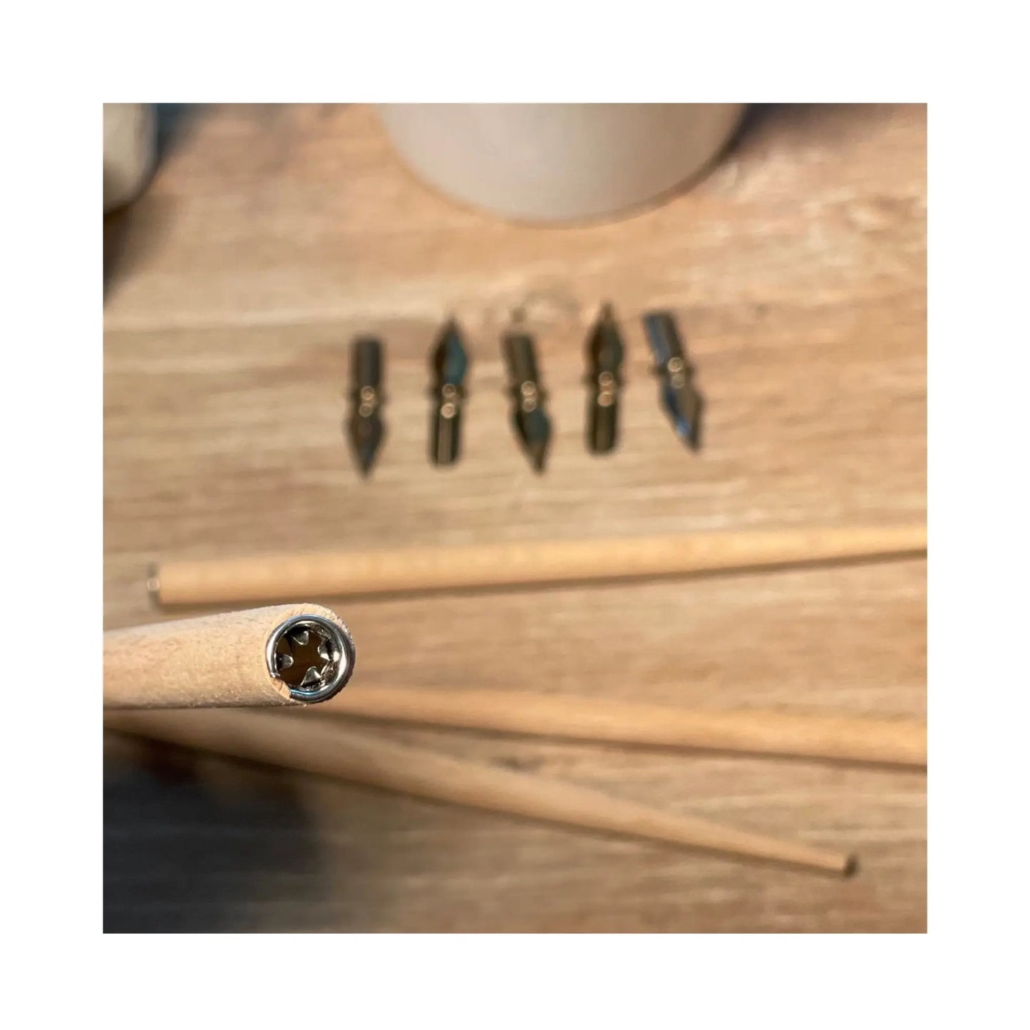 lyra dip pen set with wooden holders and interchangeable steel nibs on table