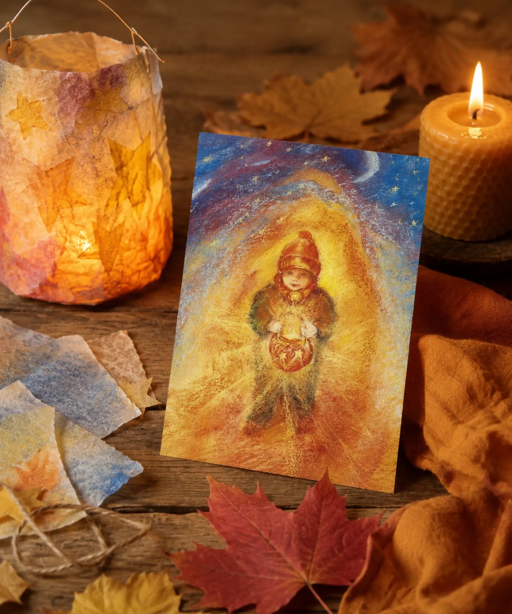 Martinmas lantern postcard by Marjan van Zeyl displayed on a rustic table with a handmade paper lantern