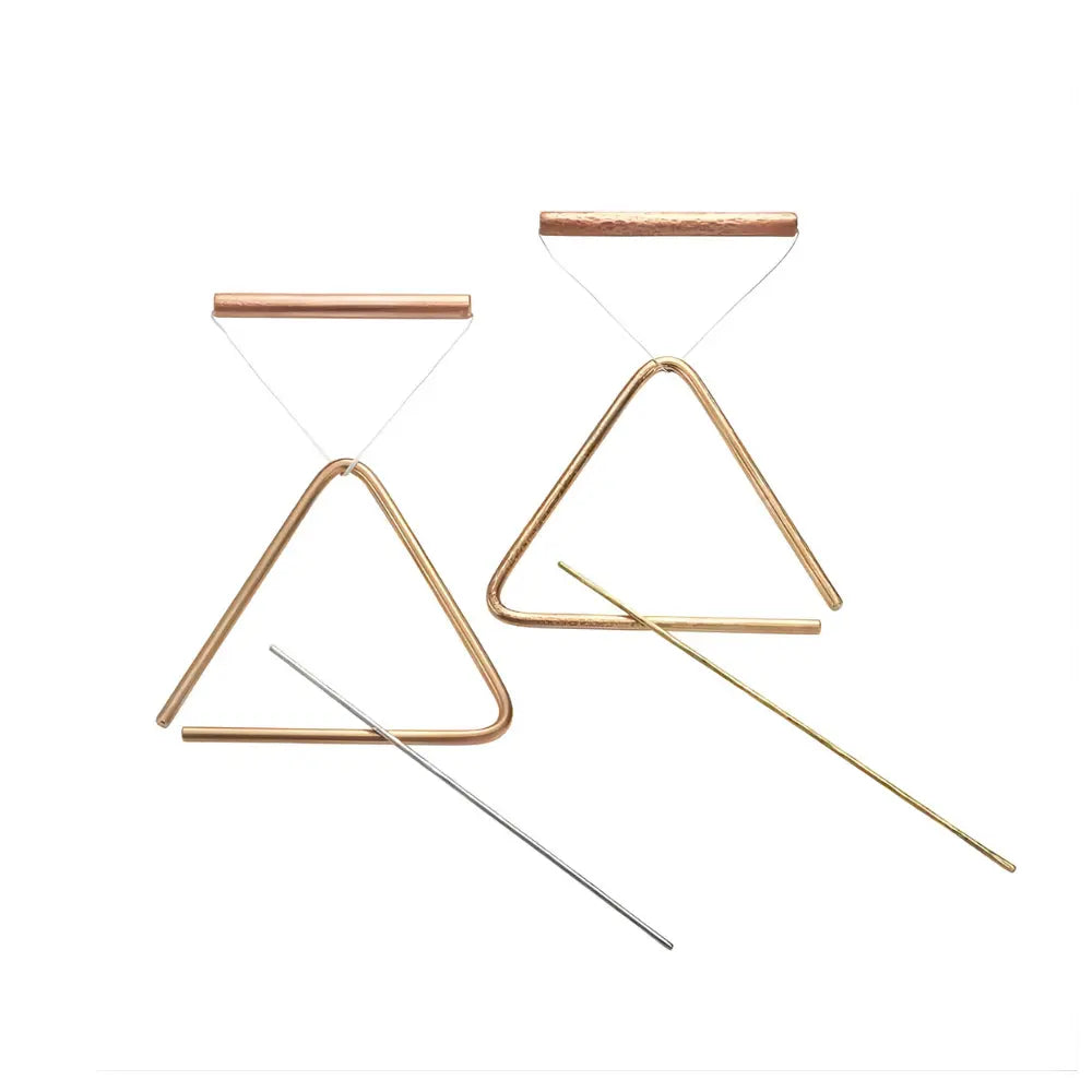 Set of brass triangle percussion instruments on a white background