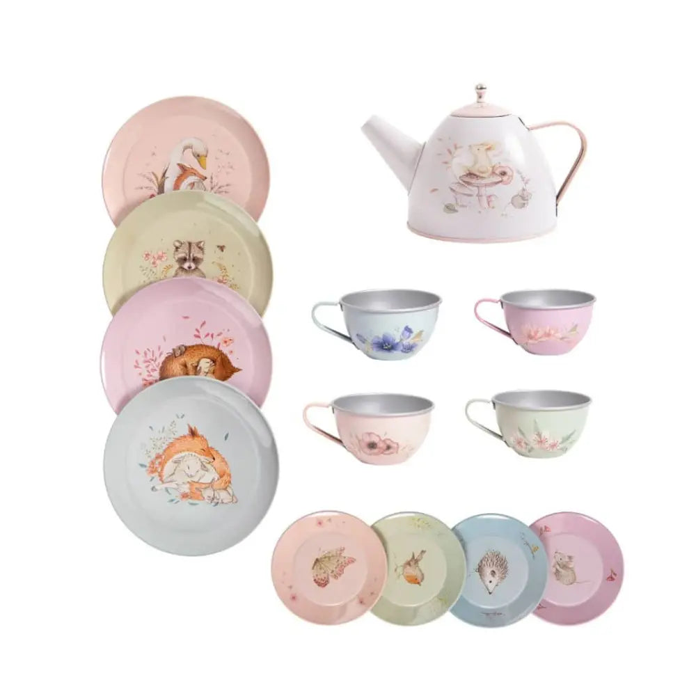 Metal tea set for children with teapot, cups, saucers, and plates arranged on table