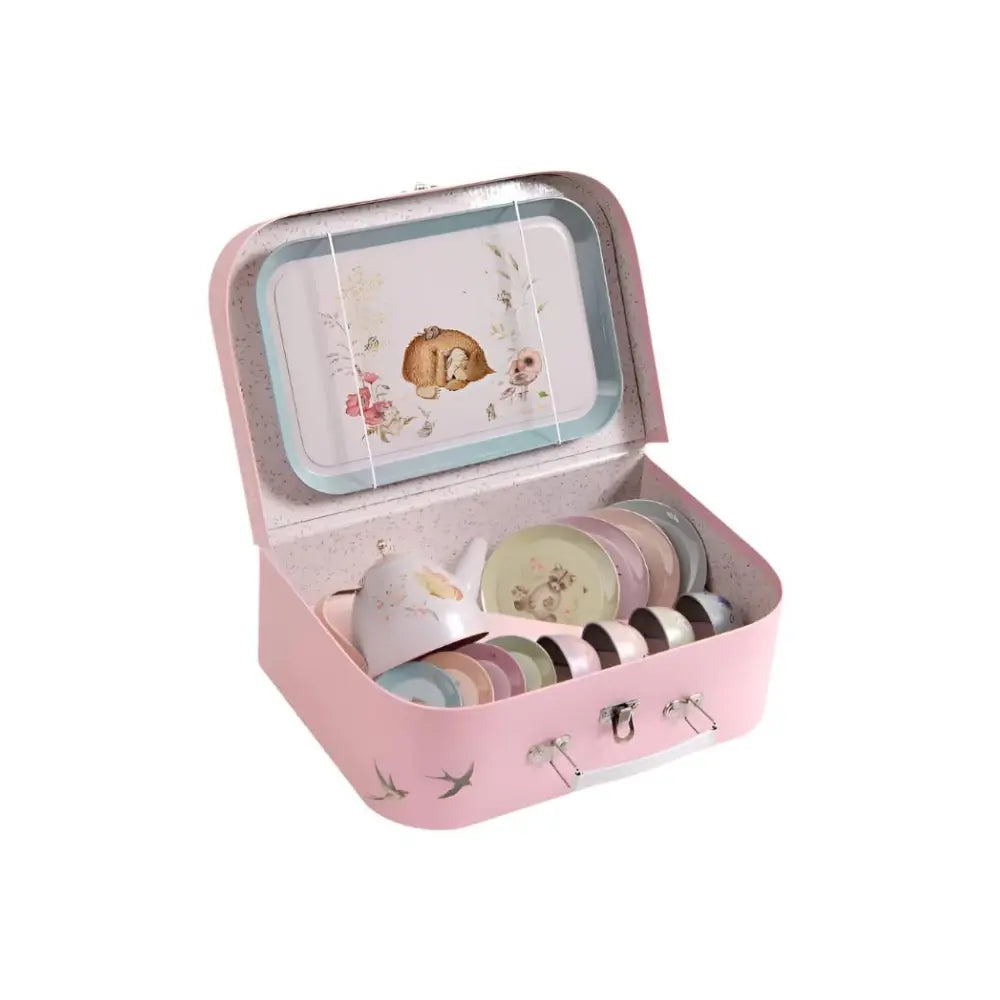 Metal tea set for children displayed inside open suitcase with teapot, cups, and saucers