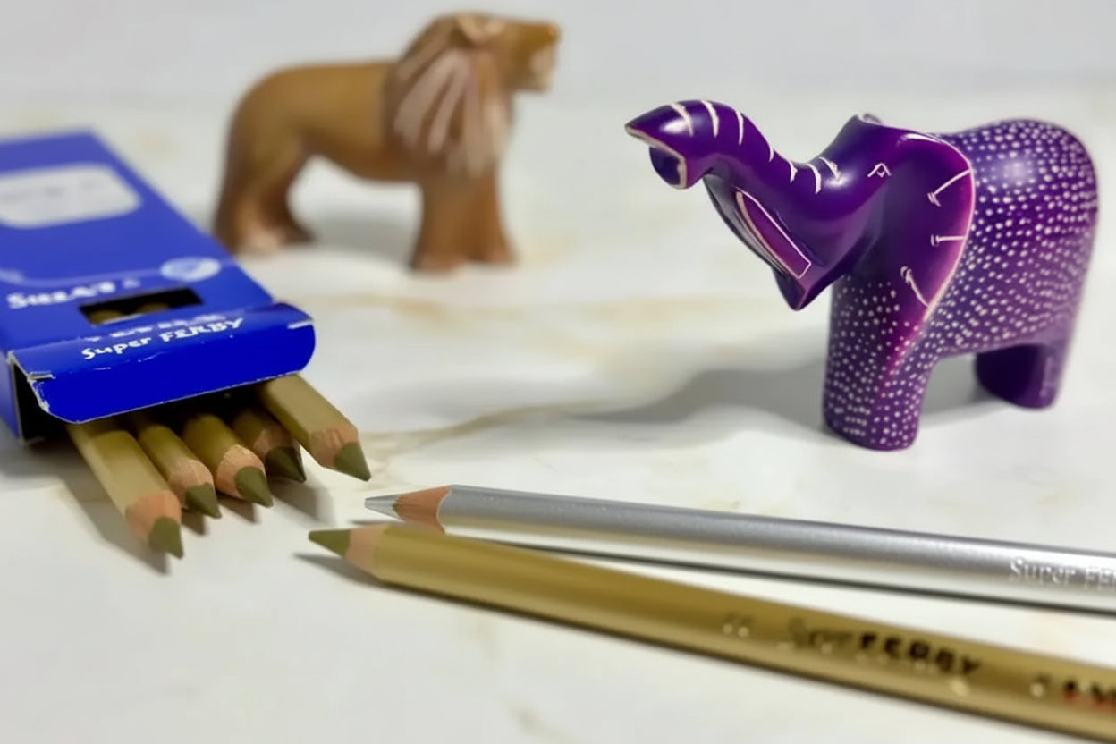 Colorful animal figurines and colored pencils on a white surface