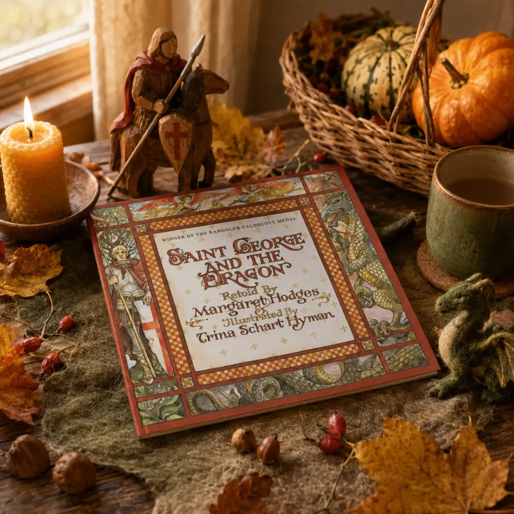 Book titled 'Saint George and the Dragon' on a table with autumn decorations including pumpkins and leaves.