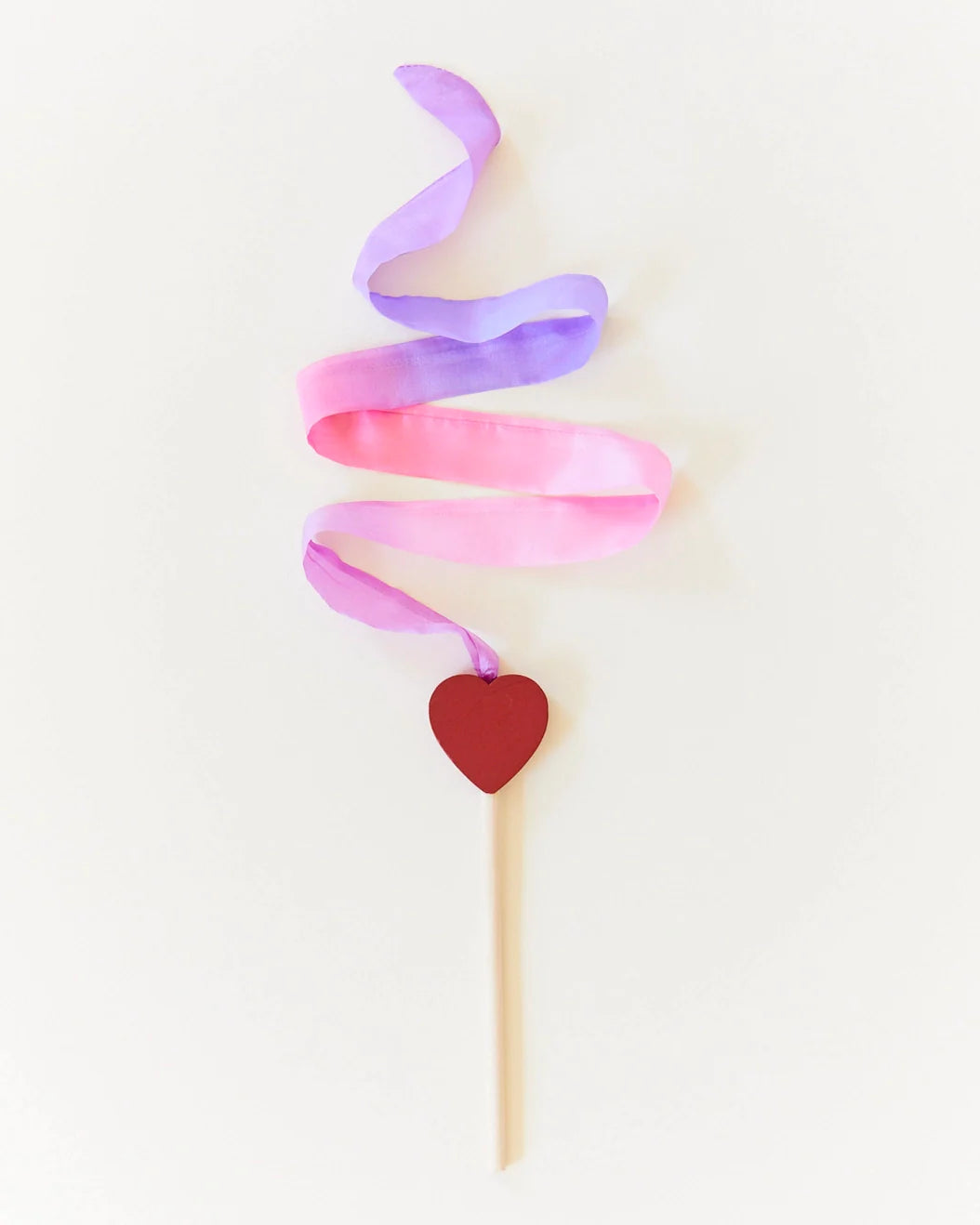 Silk Blossom colorway Streamer Wand with red heart on birch stick on light background