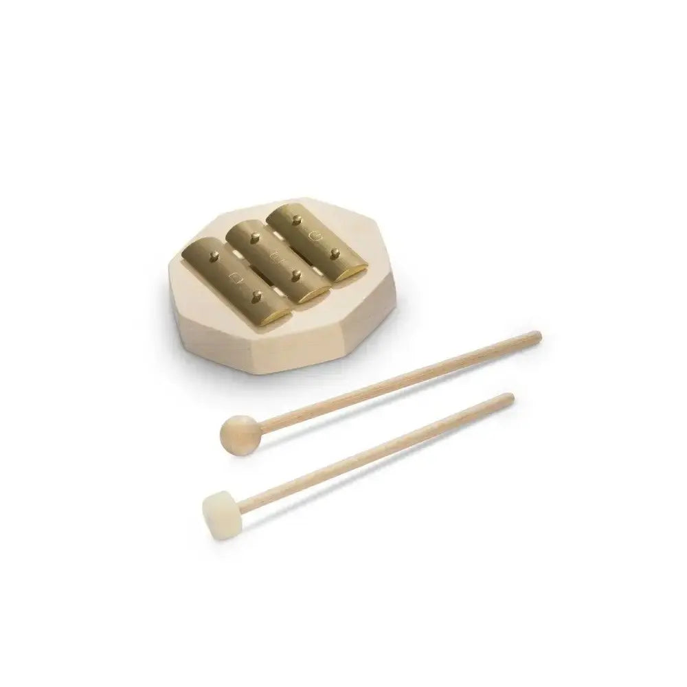 Small brass glockenspiel instrument for children with two mallets on a white background