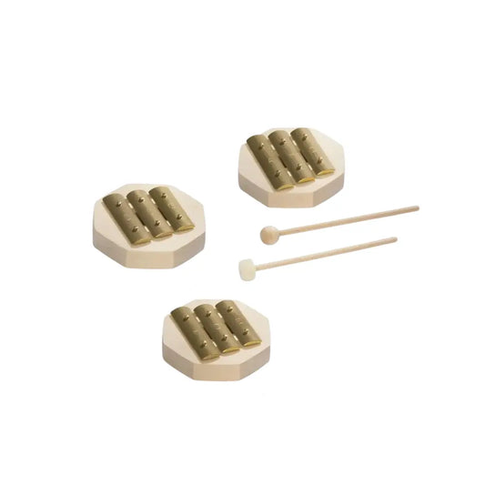 Small brass glockenspiel instrument for children with two mallets on a white background