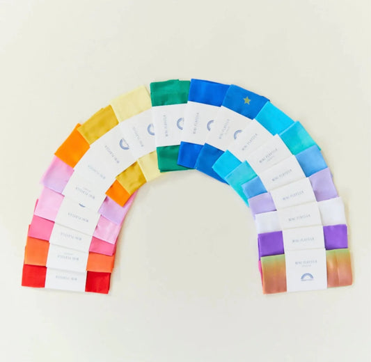 Mini Playsilks by Sarah’s Silks fanned out in a rainbow shape