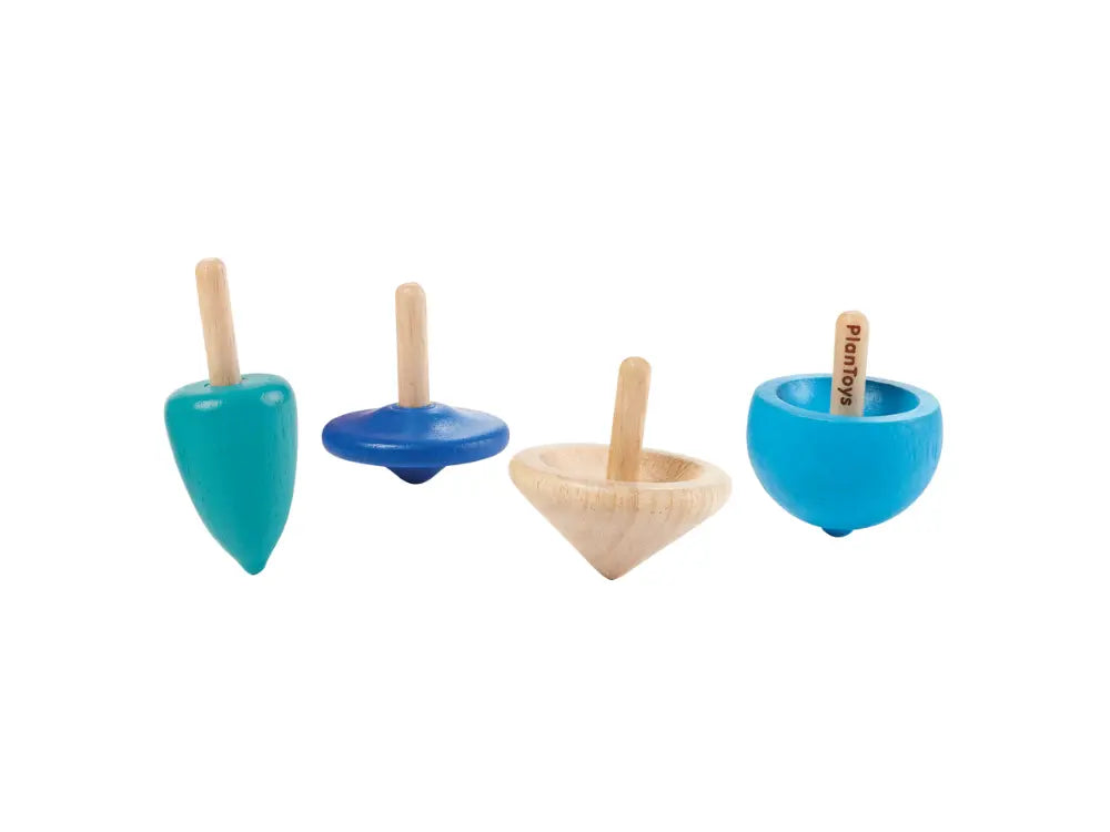 Set of four wooden top toys in different shapes and colors on a white background