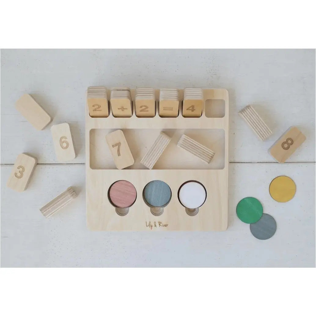 Wooden educational toy with numbers and color samples on a light wooden surface