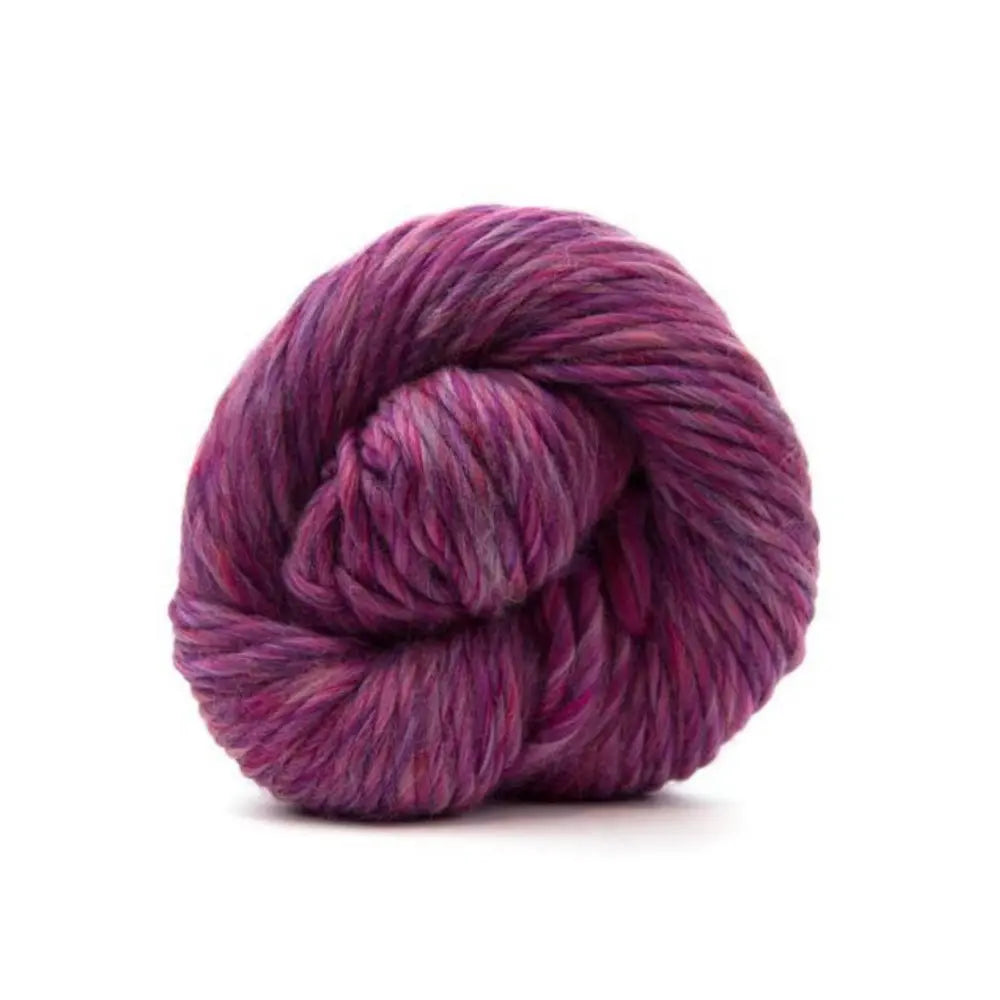 Purple skein of yarn on a white background