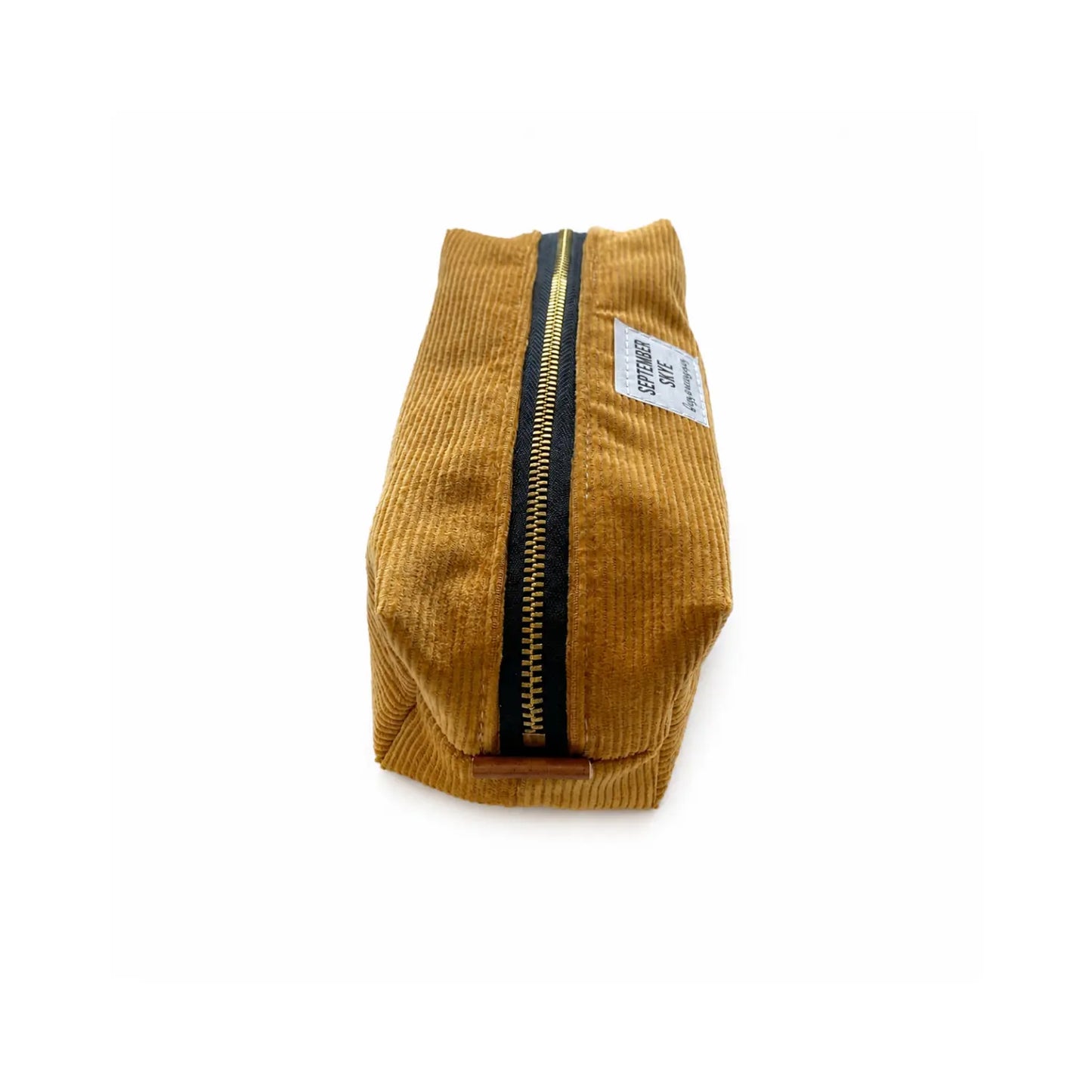 Golden mustard corduroy pencil pouch showing the structured boxy shape and metal zipper