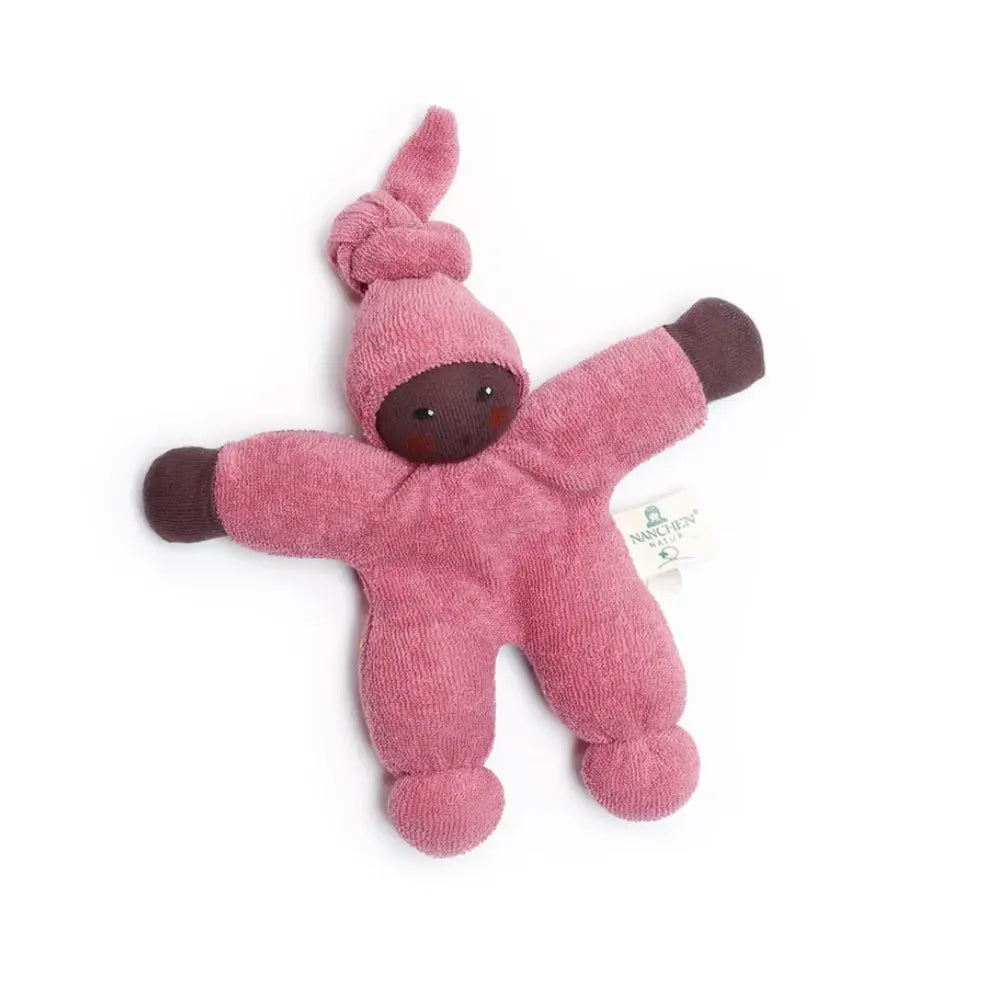 Pink terrycloth Nanchen doll with dark skin on a white background