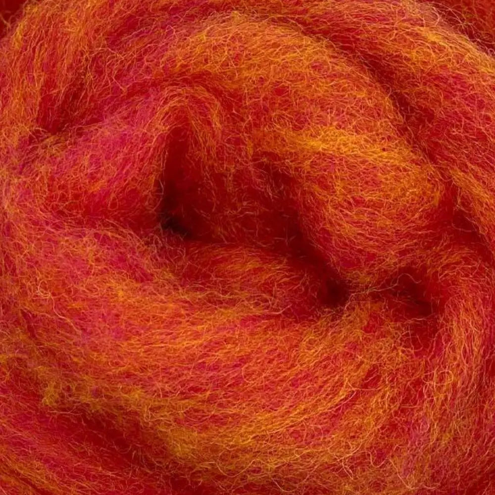 close-up of corridale wool sliver in peach melba blend of oranges