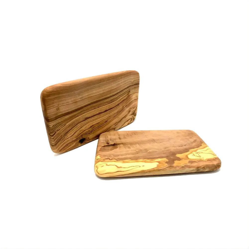 Two wooden food boards on a white background