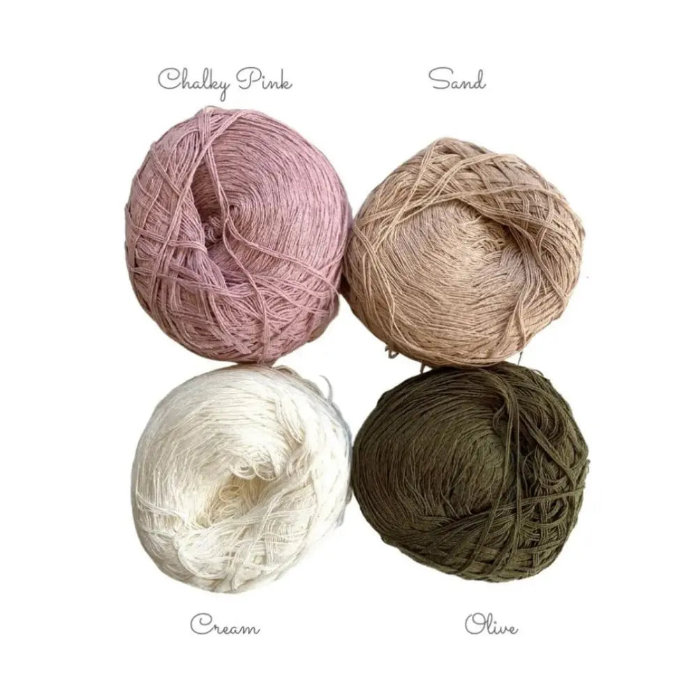 Four balls of yarn in Chalky Pink, Sand, Cream, and Olive on a white background.