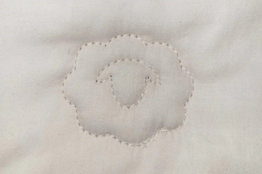 Close-up of a toddler comforter quilting surface with concentric circular pattern