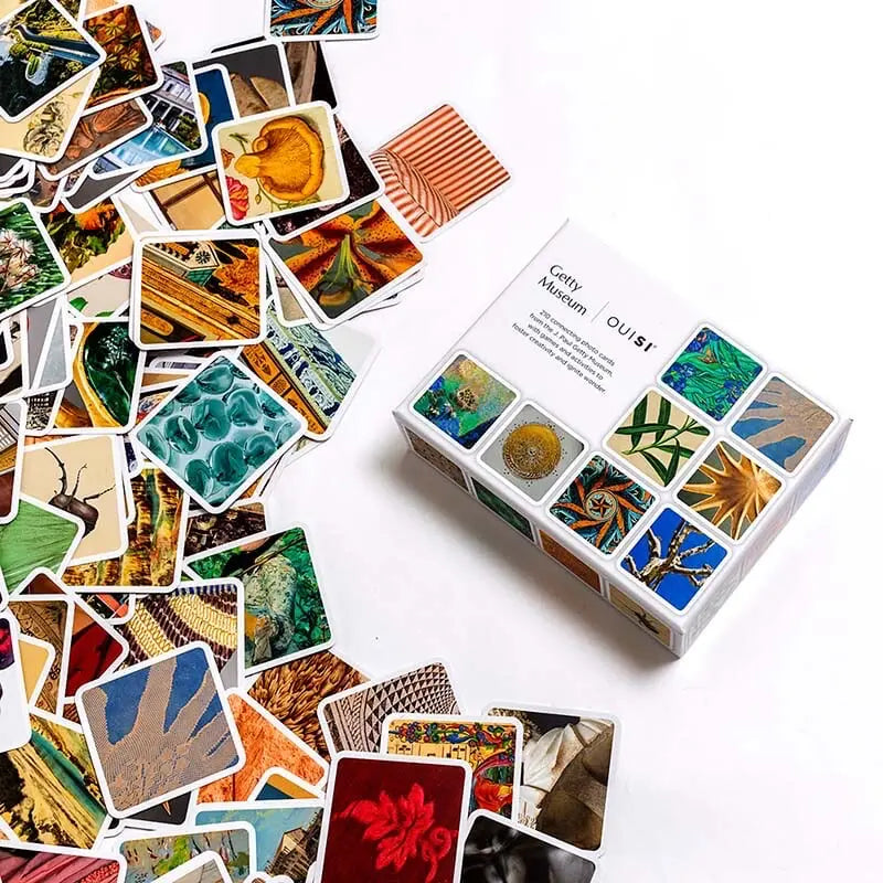 OuiSi Getty visual connection game cards spread out on table with box